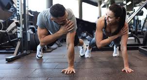 Fitness trainer demonstrating arm toning exercises Melksham