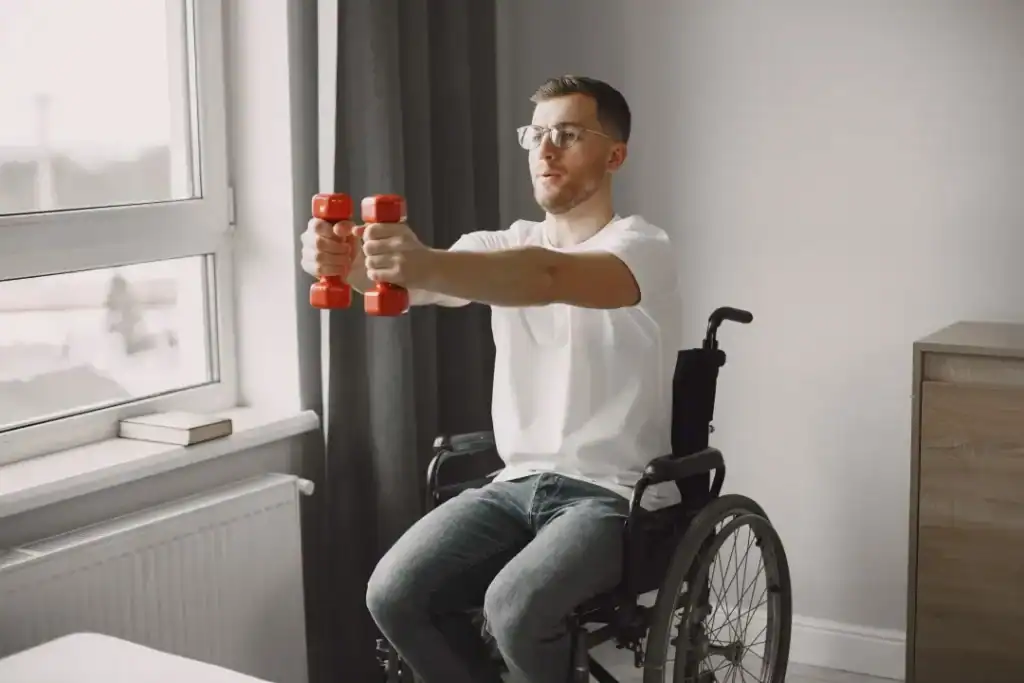 Image of man doing exercise in his wheelchair to aid weight loss Melksham