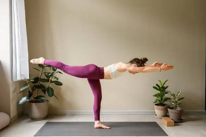Woman doing Yoga exercise Melksham to help with toning the body. 